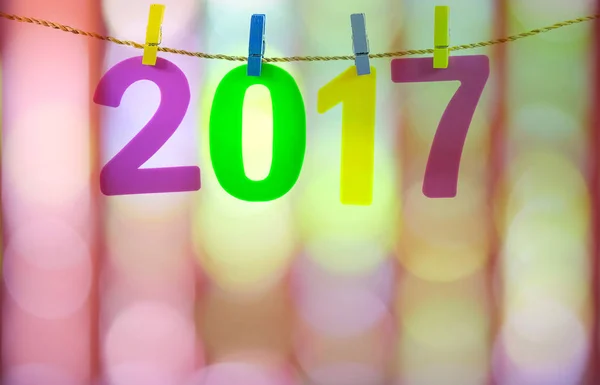 New Year 2017 number on colorfull light blurred background. — Stock Photo, Image