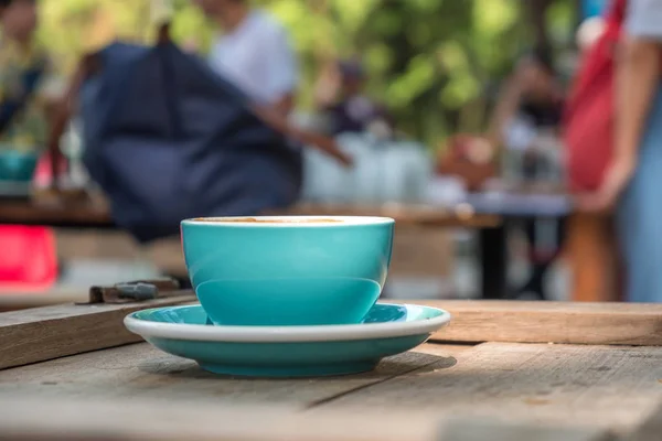 Blue coffee cup on wooden table,Close-up photo of blue coffee cu