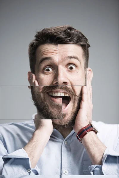 Ritratto di giovane uomo con espressione facciale scioccata — Foto Stock