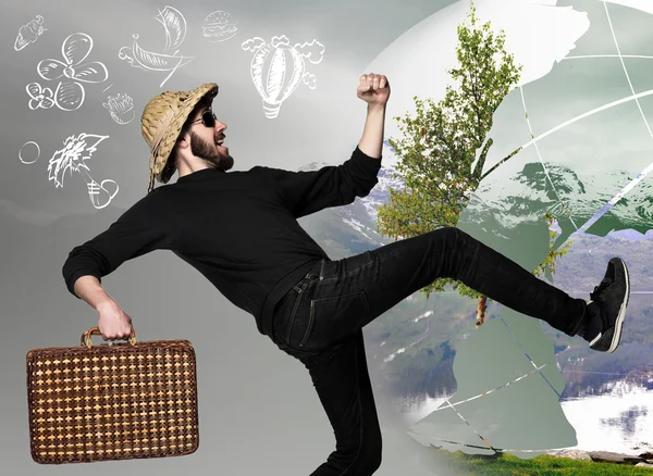 Человек с чемоданом готовы путешествовать в качестве туриста на сером фоне — стоковое фото