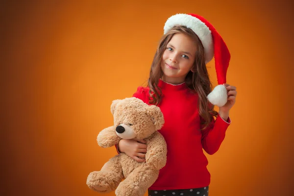 The cute cheerful little girl on orange background Royalty Free Stock Images
