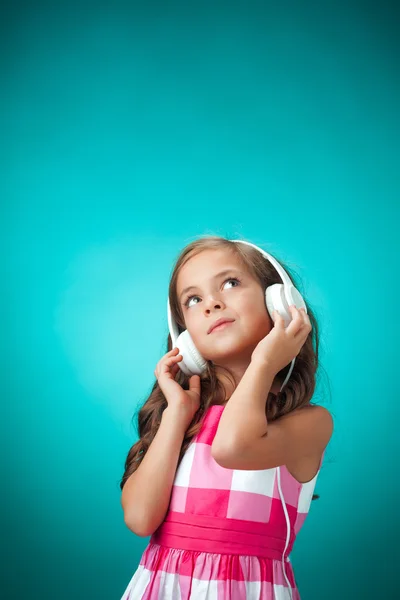 The cute cheerful little girl on orange background — Stock Photo, Image