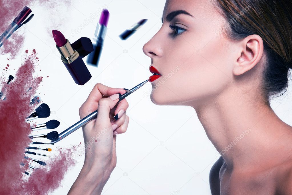 Beautiful female lips with make-up and brush