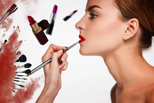 Beautiful female lips with make-up and brush — Stock Photo, Image