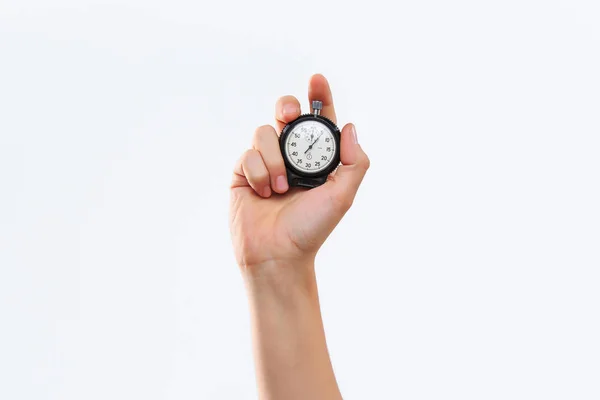 Hand met een stopwatch tegen een witte achtergrond — Stockfoto