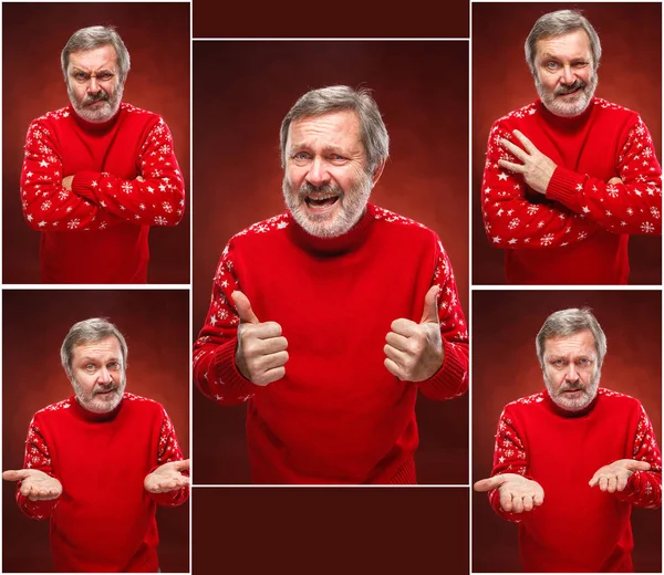 Elderly smiling man on a red background — Stock Photo, Image