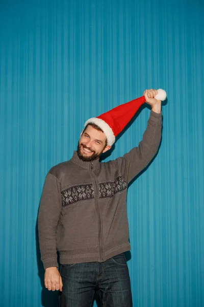 Sonriente hombre de Navidad con un sombrero de santa — Foto de Stock