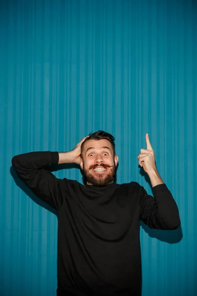 Portrait of young man with shocked facial expression — Stock Photo, Image