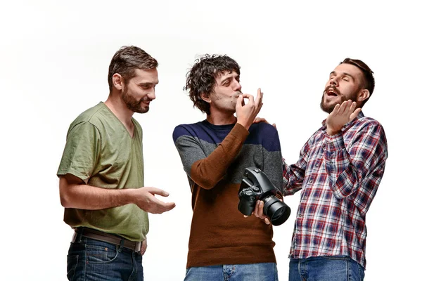 Friends with camera on white — Stock Photo, Image