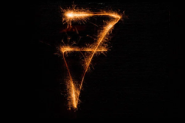 Number 7 made of sparklers on black — Stock Photo, Image