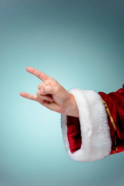 Foto de Santa Claus mano en gesto rockero — Foto de Stock