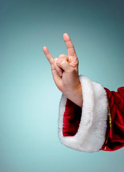 Foto de Santa Claus mano en gesto rockero — Foto de Stock