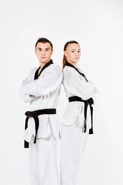 La chica karate y el niño con cinturones negros — Foto de Stock