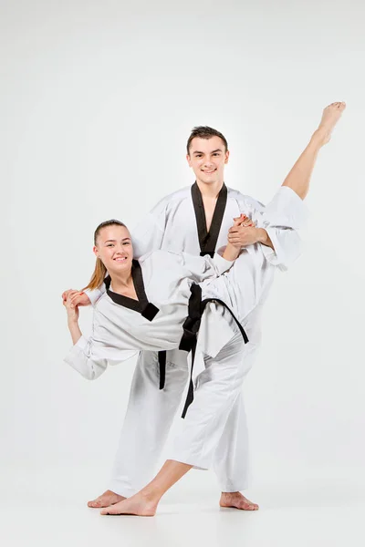 The karate girl and boy with black belts — Stock Photo, Image