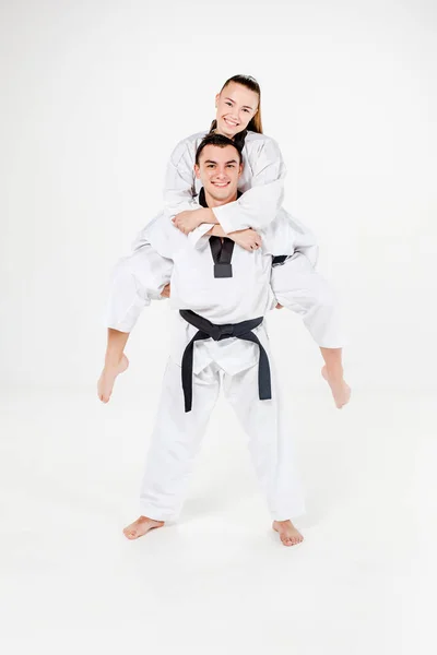 The karate girl and boy with black belts — Stock Photo, Image