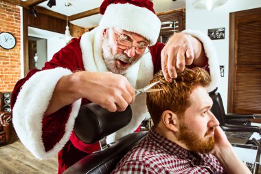 Santa claus as master at barber shop clipart