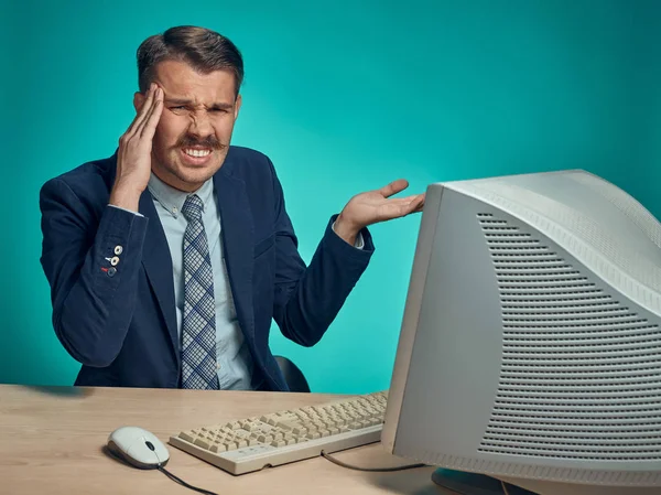 Sad Young Man Working On computer At Desk — Stock Photo, Image