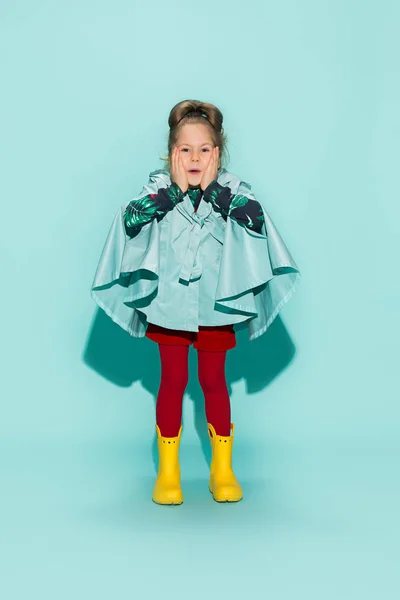 Little girl posing in fashion style wearing autumn clothing.