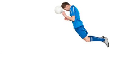 Uçan tekme yaparken futbol topu ile genç çocuk