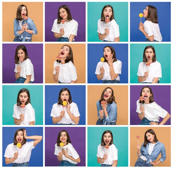 Junge Frau mit dem bunten Lutscher im Studio — Stockfoto