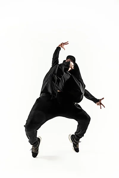 Het silhouet van een hip hop mannelijke pauze danser dansen op witte achtergrond — Stockfoto