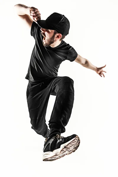 La silueta de un bailarín de break masculino de hip hop bailando sobre fondo blanco —  Fotos de Stock