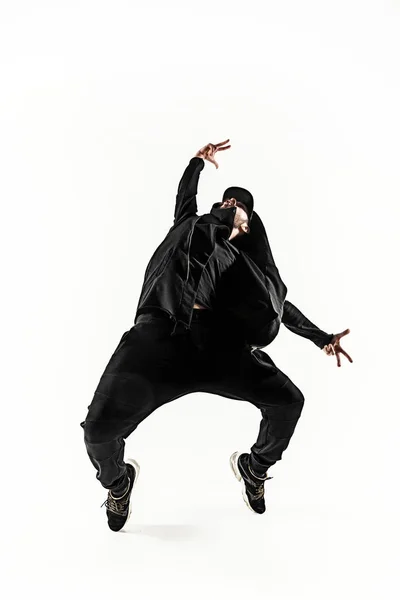 The silhouette of one hip hop male break dancer dancing on white background Stock Picture
