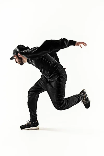 在白色背景上跳舞的一个嘻哈男打破舞者的剪影 — 图库照片