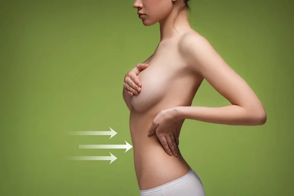 Frauen-Bauch mit den Zeichnungspfeilen — Stockfoto