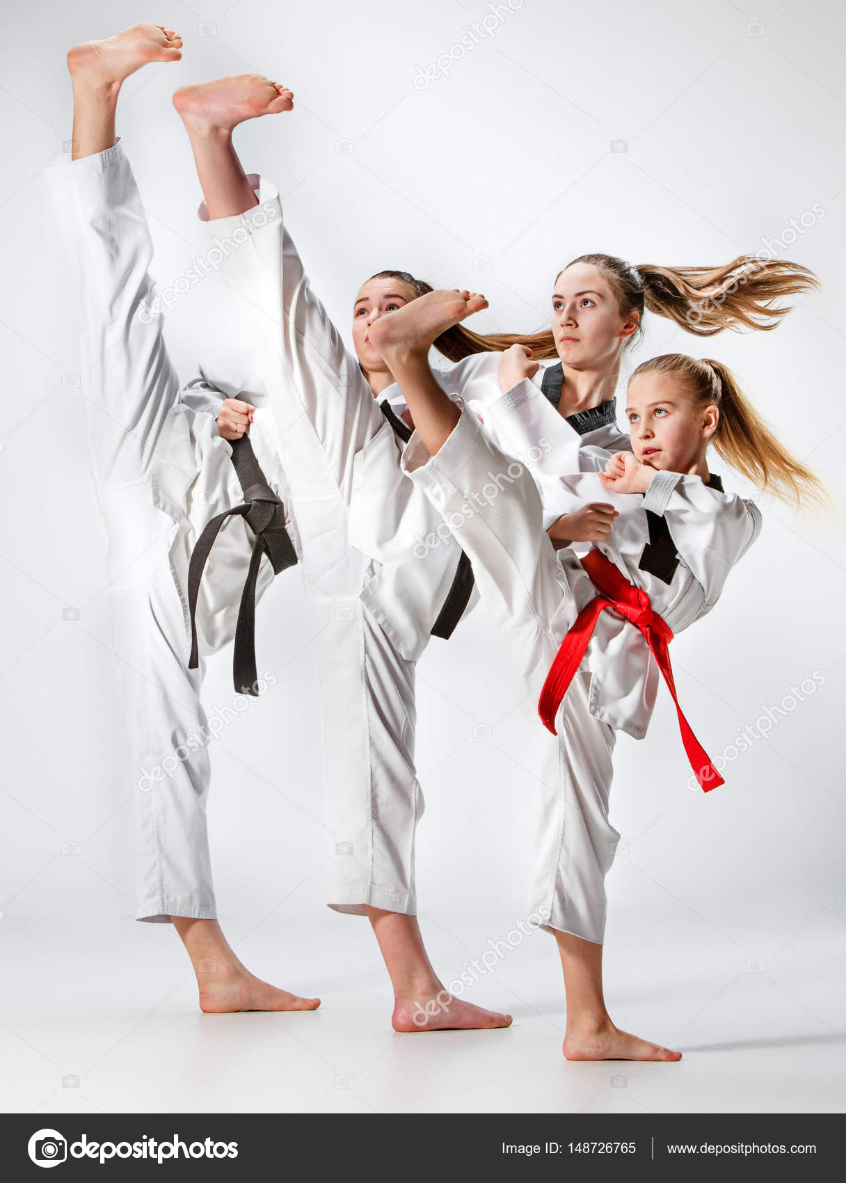 The studio shot of group of kids training karate martial arts — Stock