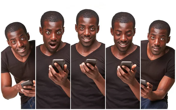 Retrato de un hombre africano sonriente hablando por teléfono aislado sobre un fondo blanco —  Fotos de Stock