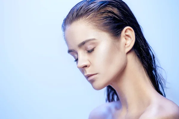 Beautiful woman face portrait close up on blue — Stock Photo, Image