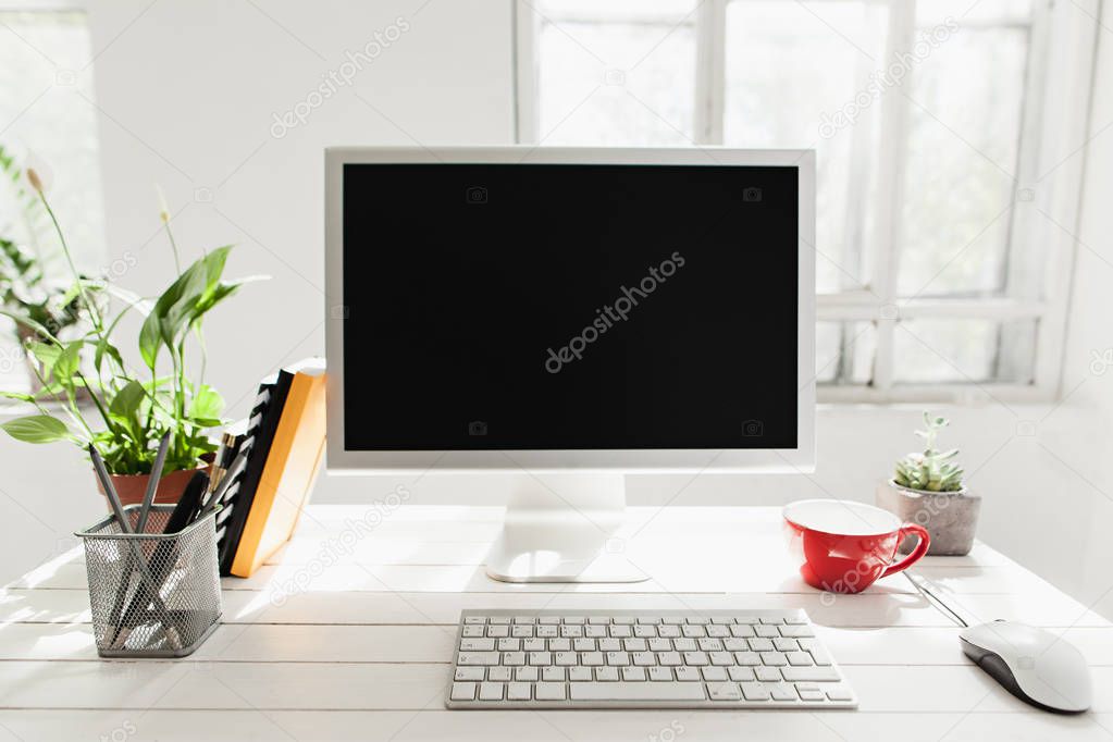 Stylish workspace with computer on home or studio