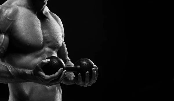 The torso of attractive male body builder on black background. — Stock Photo, Image