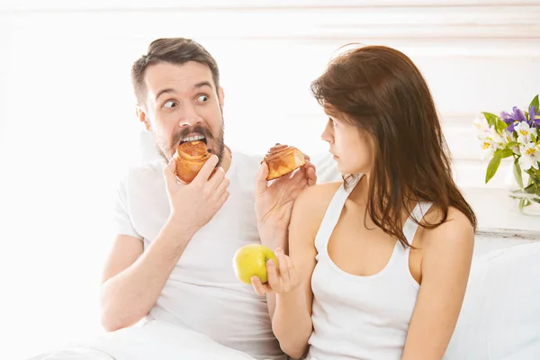 Relaxed Couple in Bed in bedroom at home