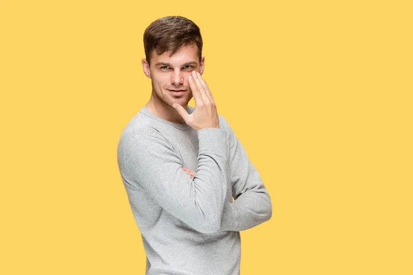 The young man smiling and looking at camera — Stock Photo, Image