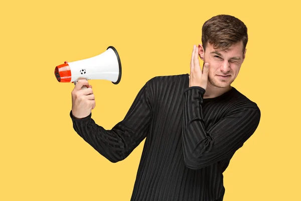 The young man holding a megaphone — Stock Photo, Image