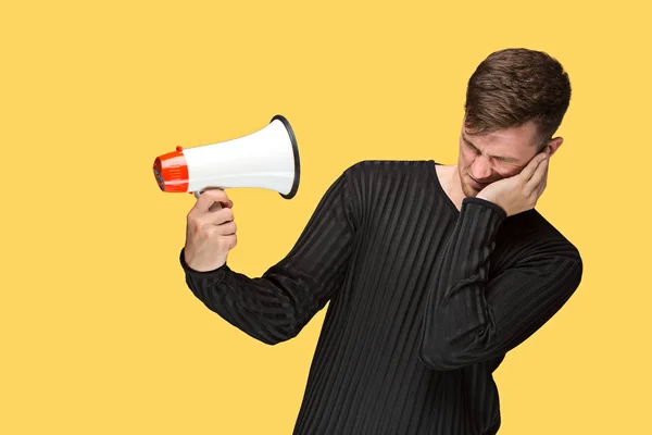 The young man holding a megaphone — Stock Photo, Image