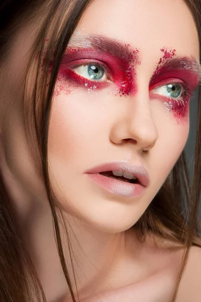 Beautiful woman face portrait close up with red make up — Stock Photo, Image