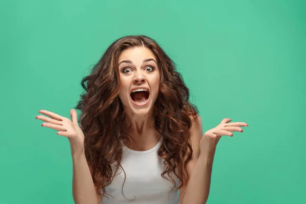 Portrait of young woman with shocked facial expression — Stock Photo, Image