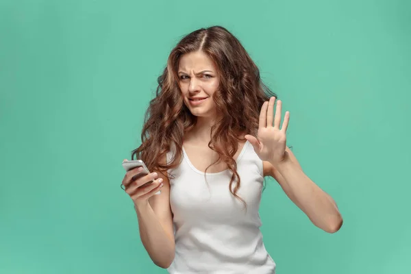 The portrait of disgusted woman with mobile phone — Stock Photo, Image