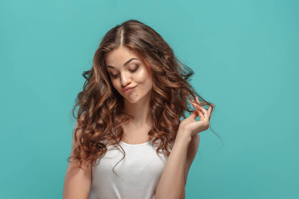 The young womans portrait with sad emotions