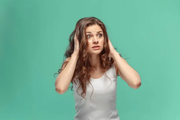 Portrait of young woman with shocked facial expression — Stock Photo, Image
