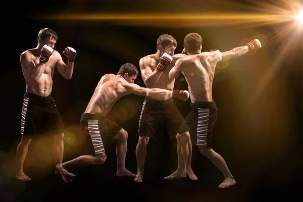 Mannelijke bokser boksen in bokszak met dramatische edgy verlichting in een donkere studio — Stockfoto