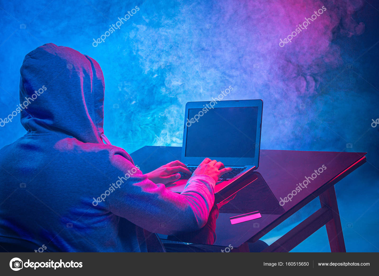 Hooded computer hacker stealing information with laptop Stock Photo by ...