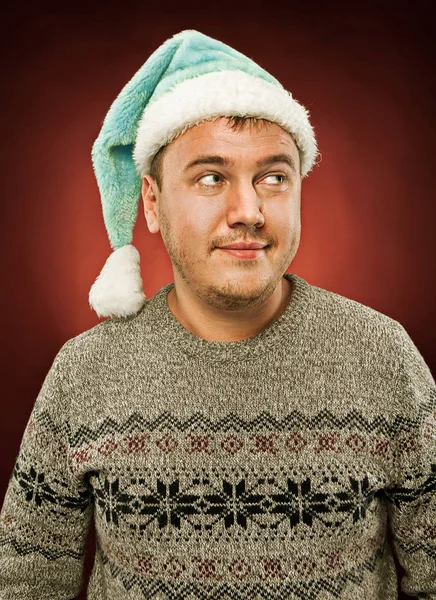 Sorprendido hombre de Navidad con un sombrero de santa — Foto de Stock