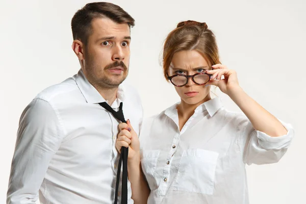 The business man and woman communicating on a gray background — Stock Photo, Image