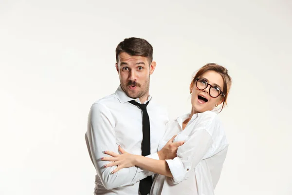 The business man and woman communicating on a gray background — Stock Photo, Image