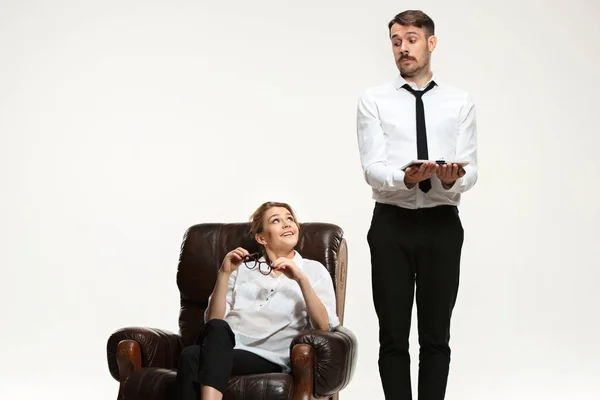 The young man and beautiful woman in business suit at office on white background — Stock Photo, Image