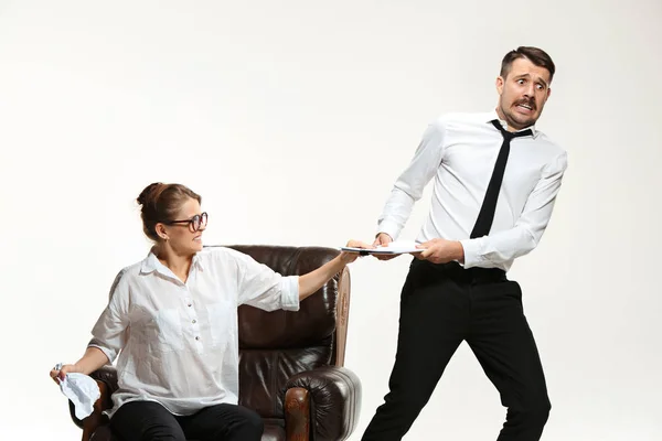 The young man and beautiful woman in business suit at office on white background — Stock Photo, Image